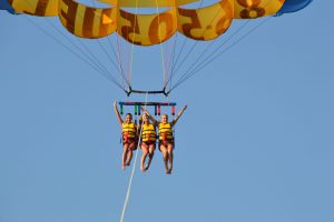 Tourists enjoying parasailing with Miami Watersports